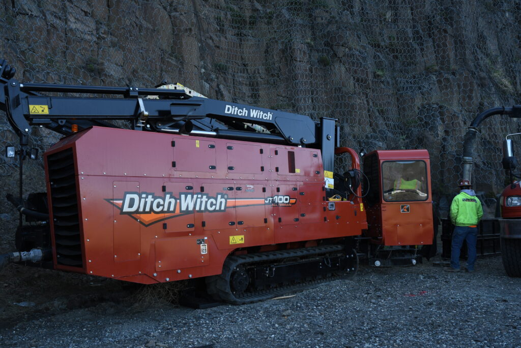 Cannon crew and excavation equipment on a utility right of way