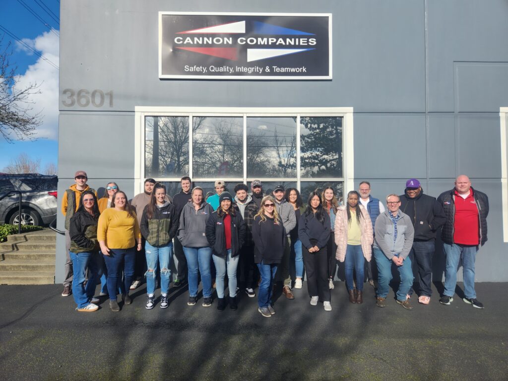 Cannon team members in front of the Milton headquarters